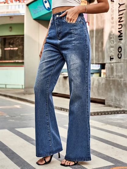 Pantalones de mezclilla acampanados de cintura media versátiles.